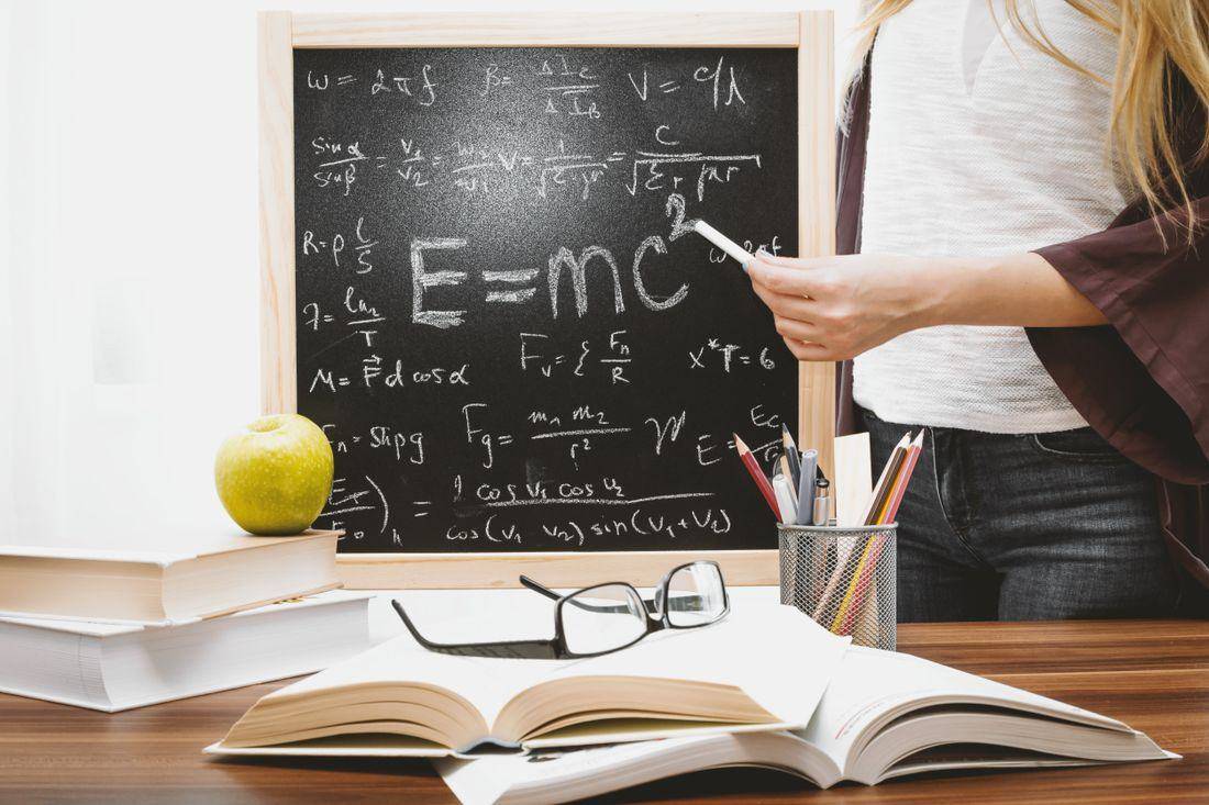 Physics equations on the blackboard