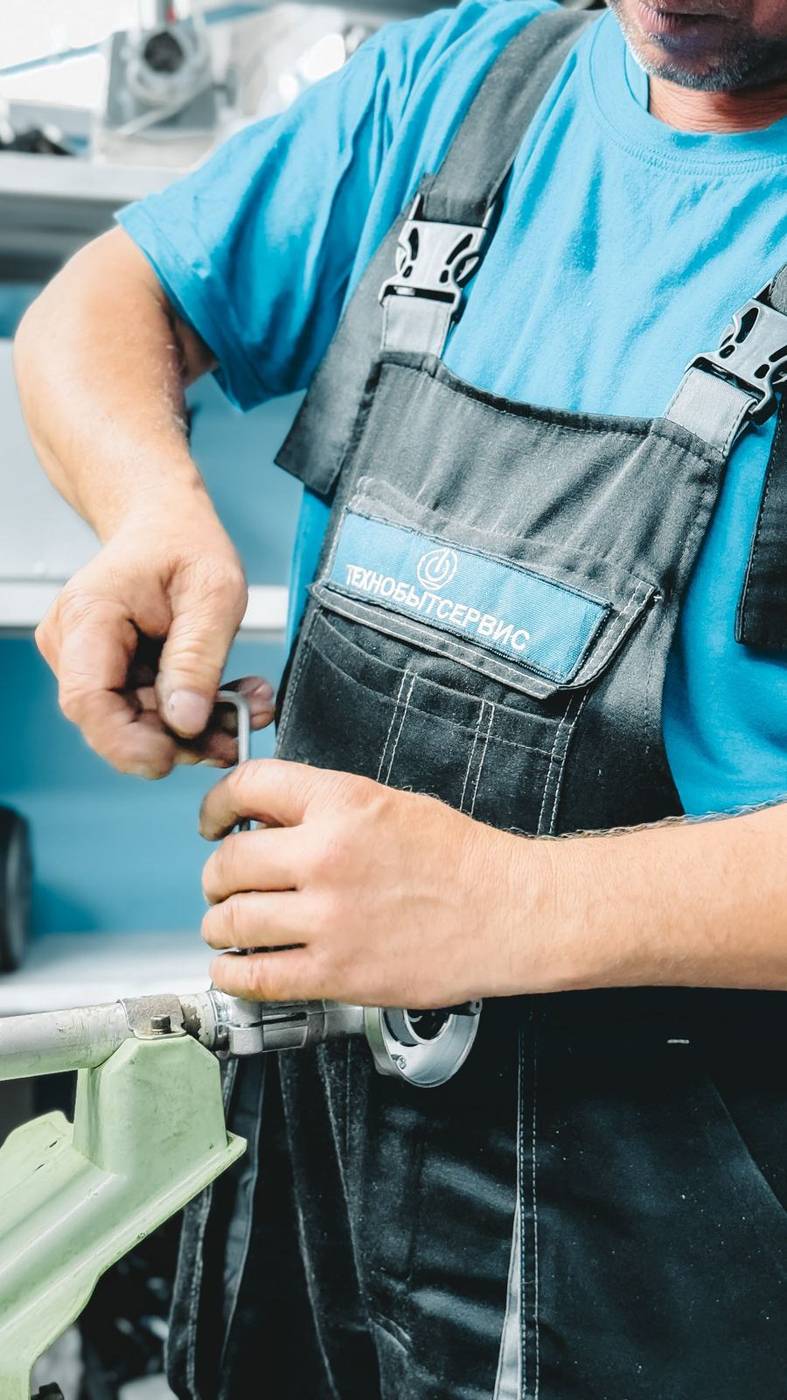 FlowFix plumber repairing a pipe