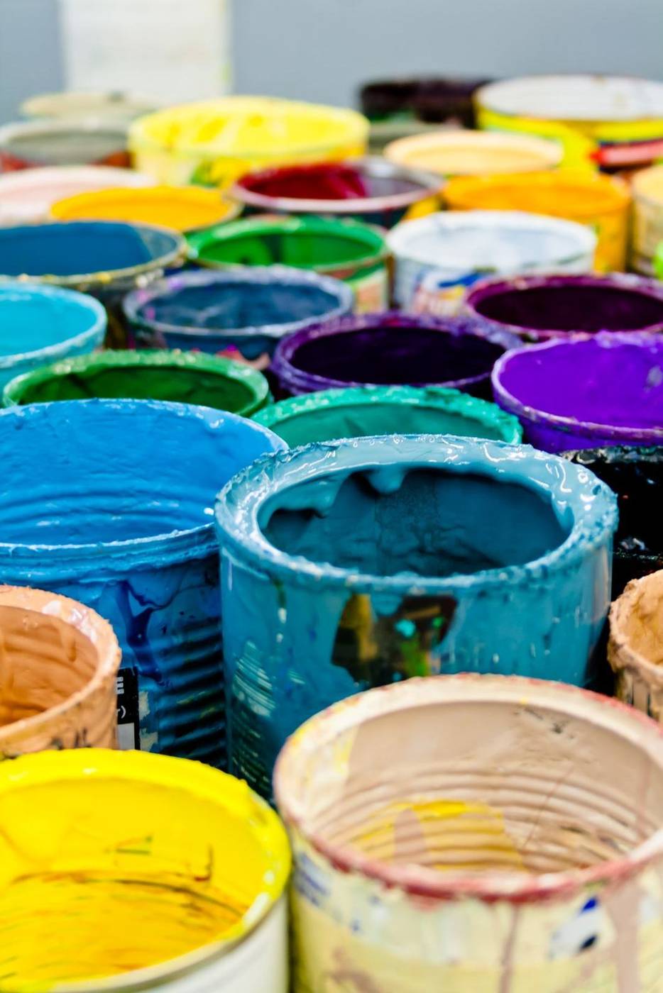 Paint tins in many colours